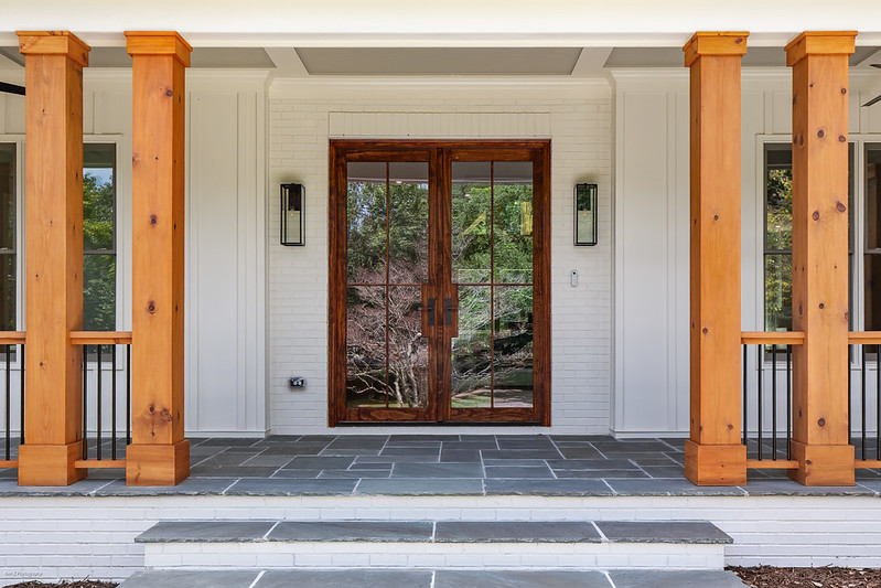 Front porch with cedar posts, slate floor, and a double wood entry door, Brookcliff new custom home, Marietta, GA