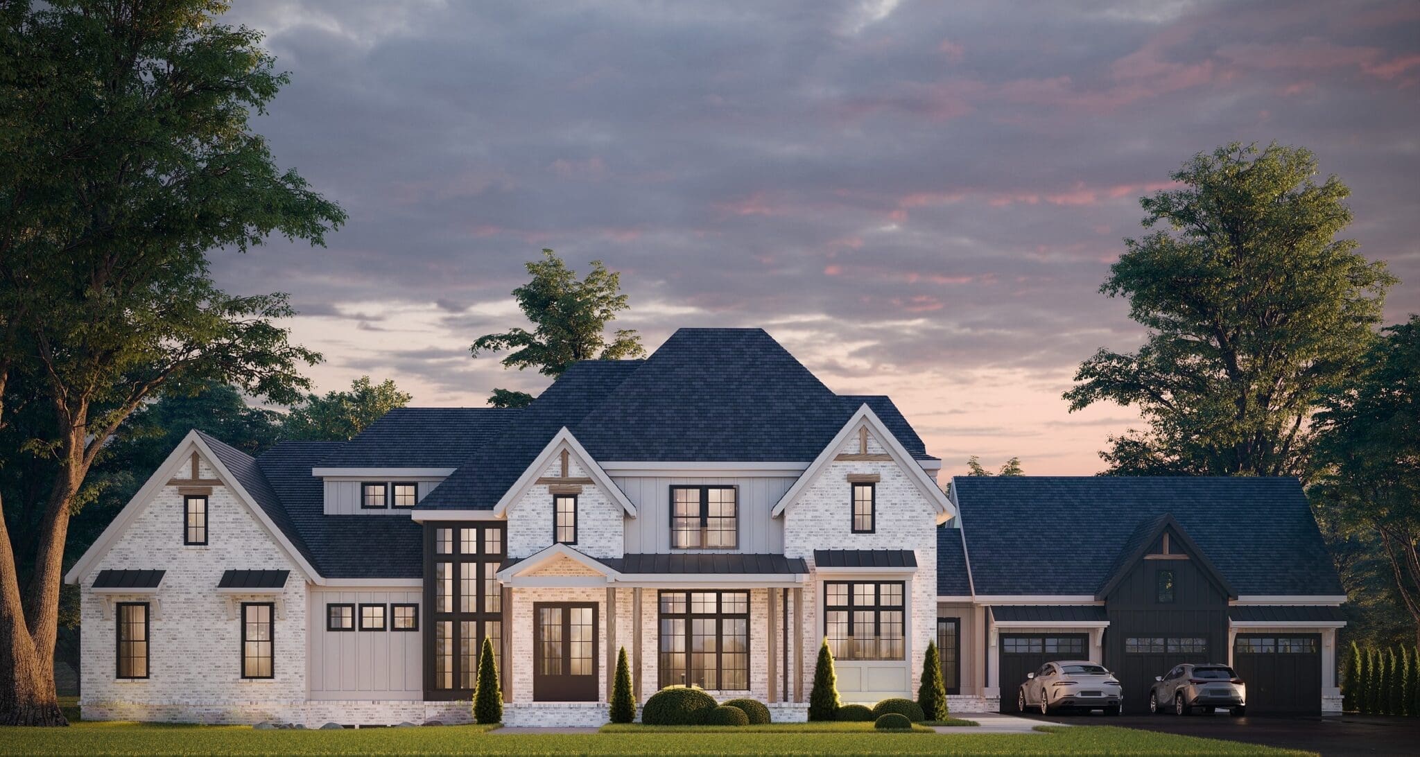 A large white house with a black roof and two car garage.