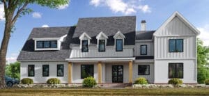 A large white house with black trim and windows.