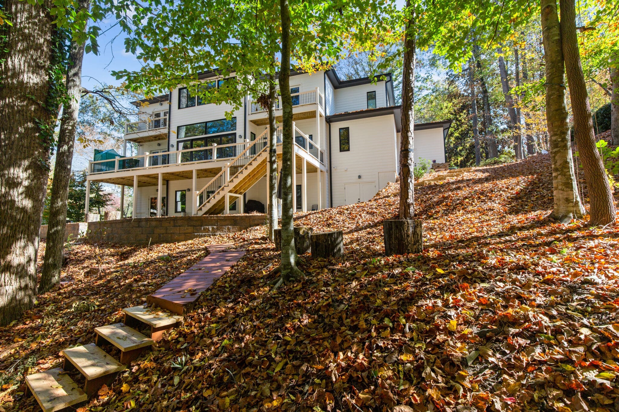 A house with stairs and trees in the background