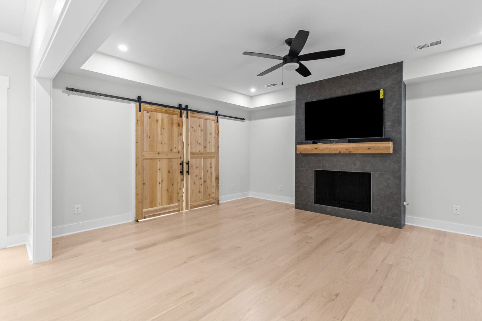 Modern living room with fireplace and sliding doors.