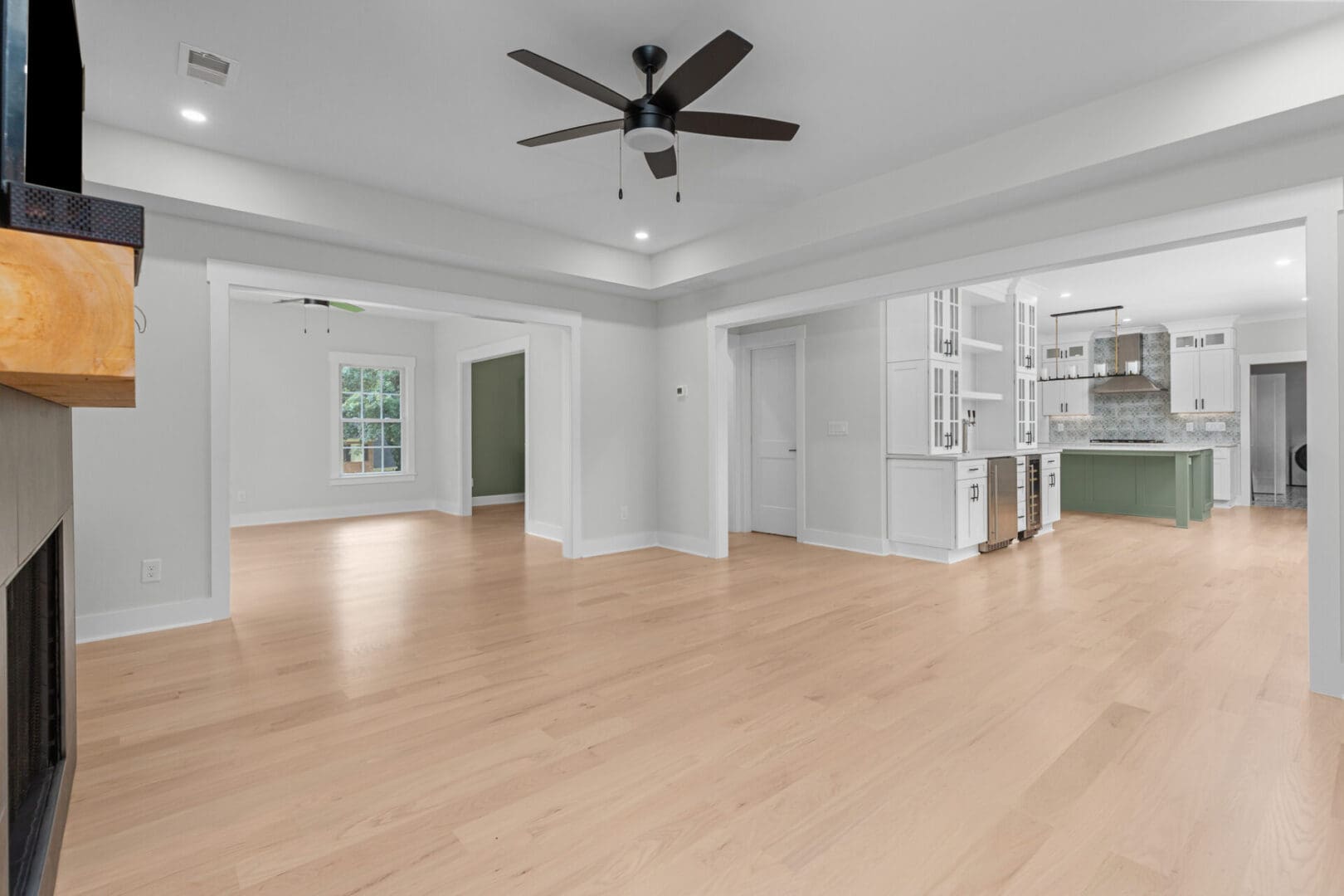 Open concept living room with kitchen access.