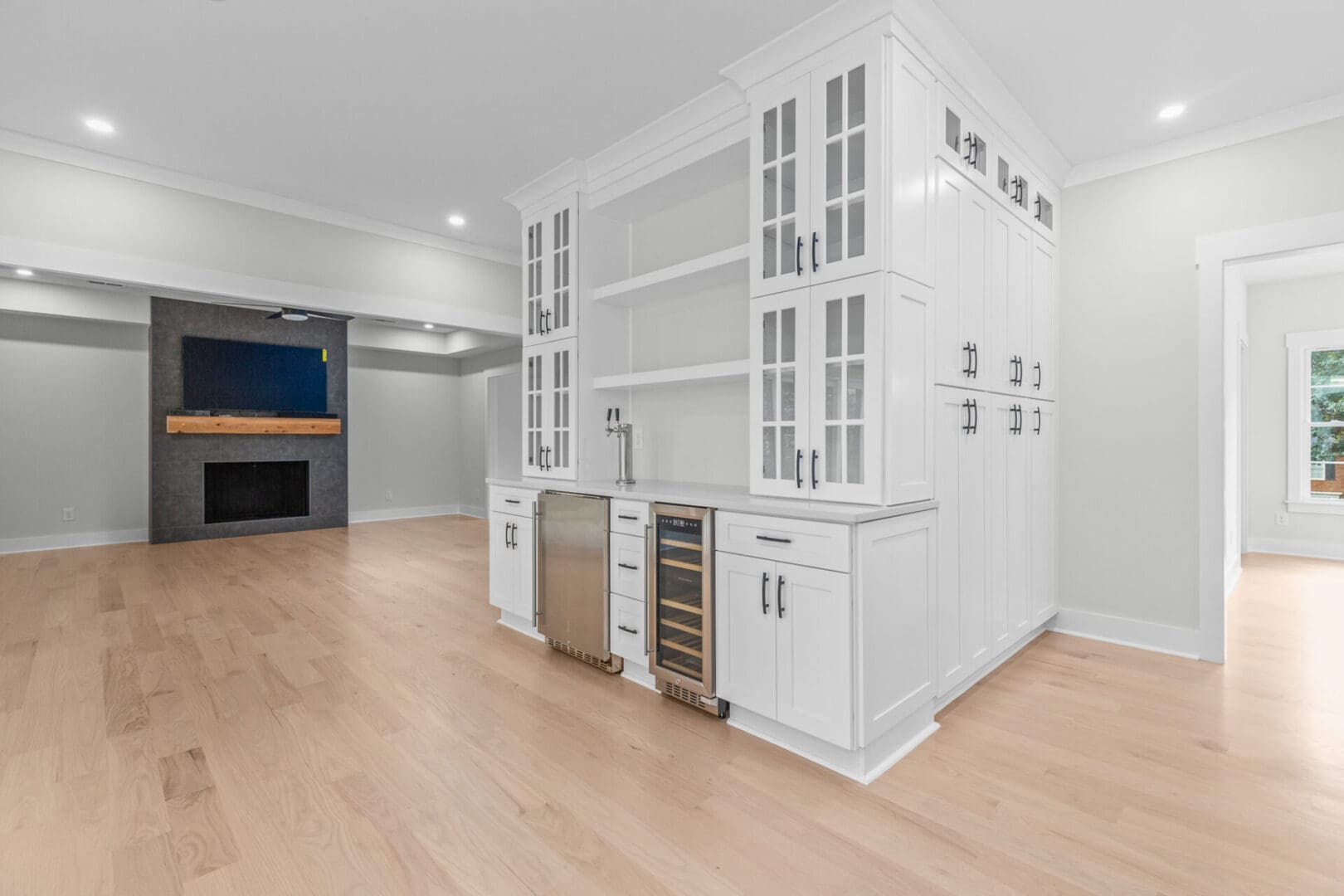 White kitchen cabinets with glass doors.