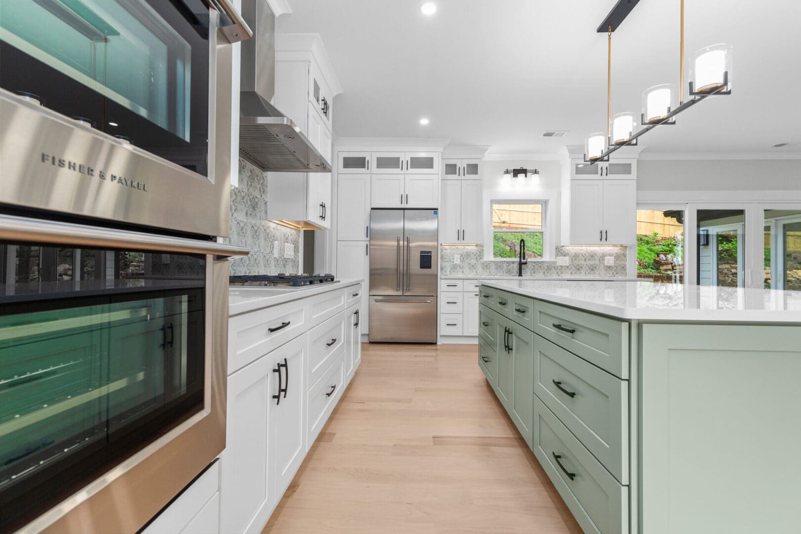 Modern kitchen with stainless steel appliances.