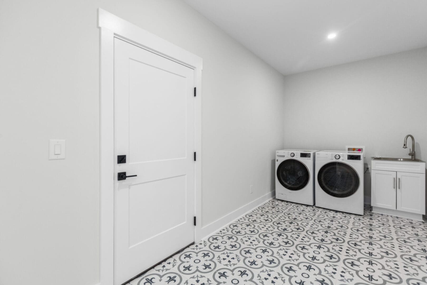 White laundry room with washer and dryer.