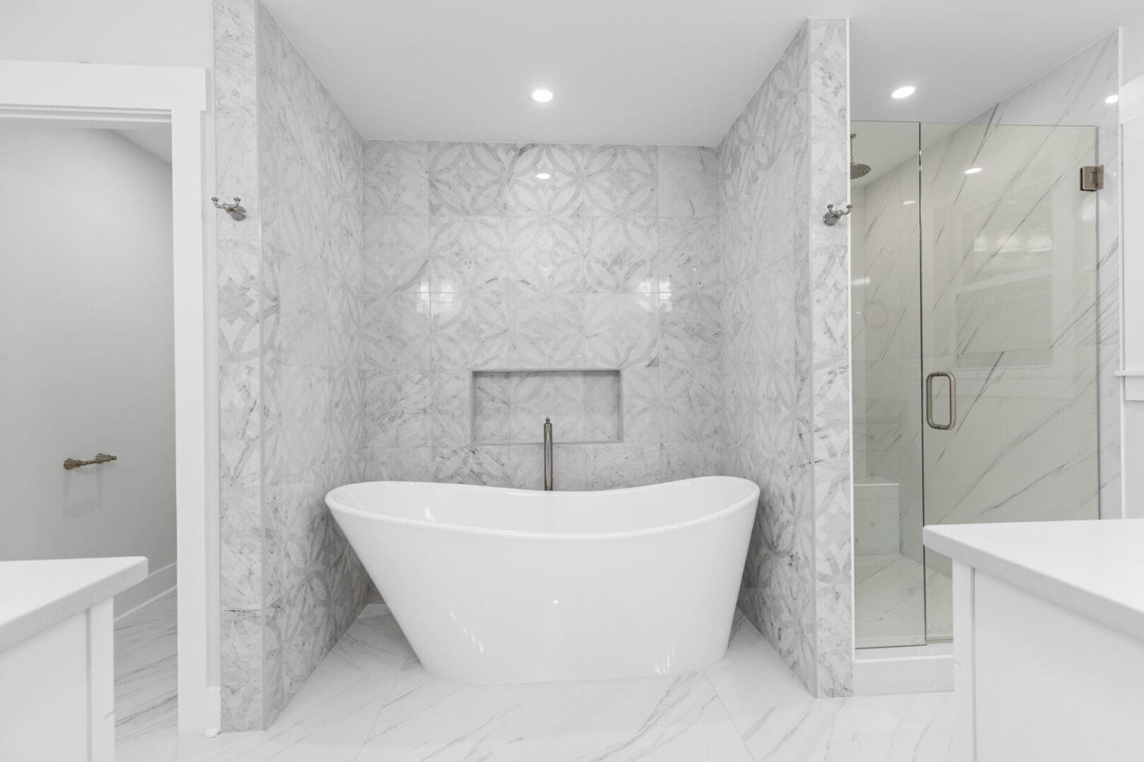 White bathtub and shower in a modern bathroom.
