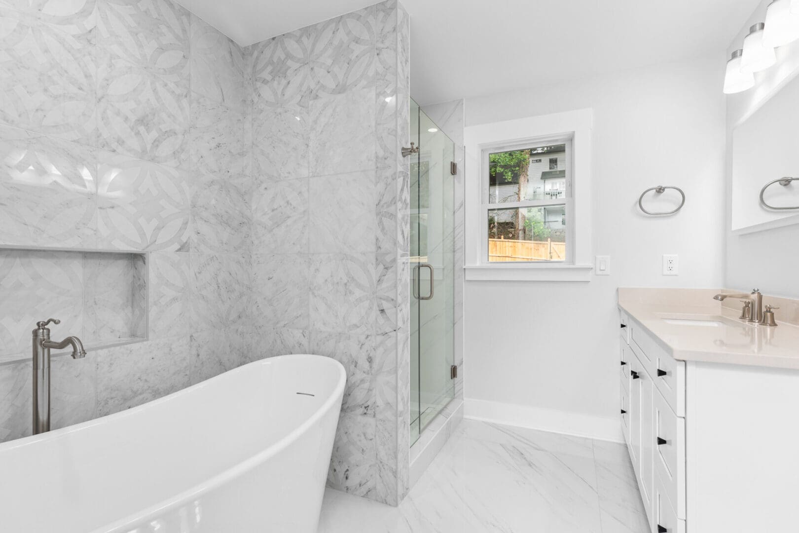 White bathroom with bathtub and shower.