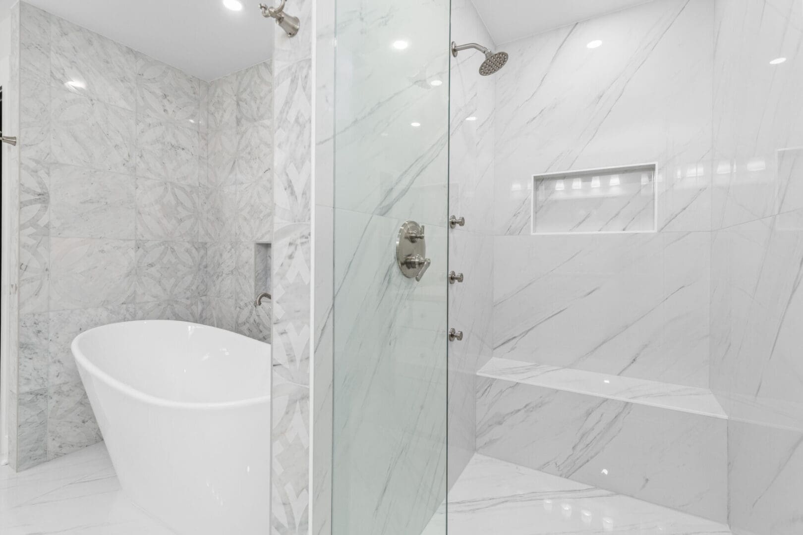 White marble bathroom with soaking tub.