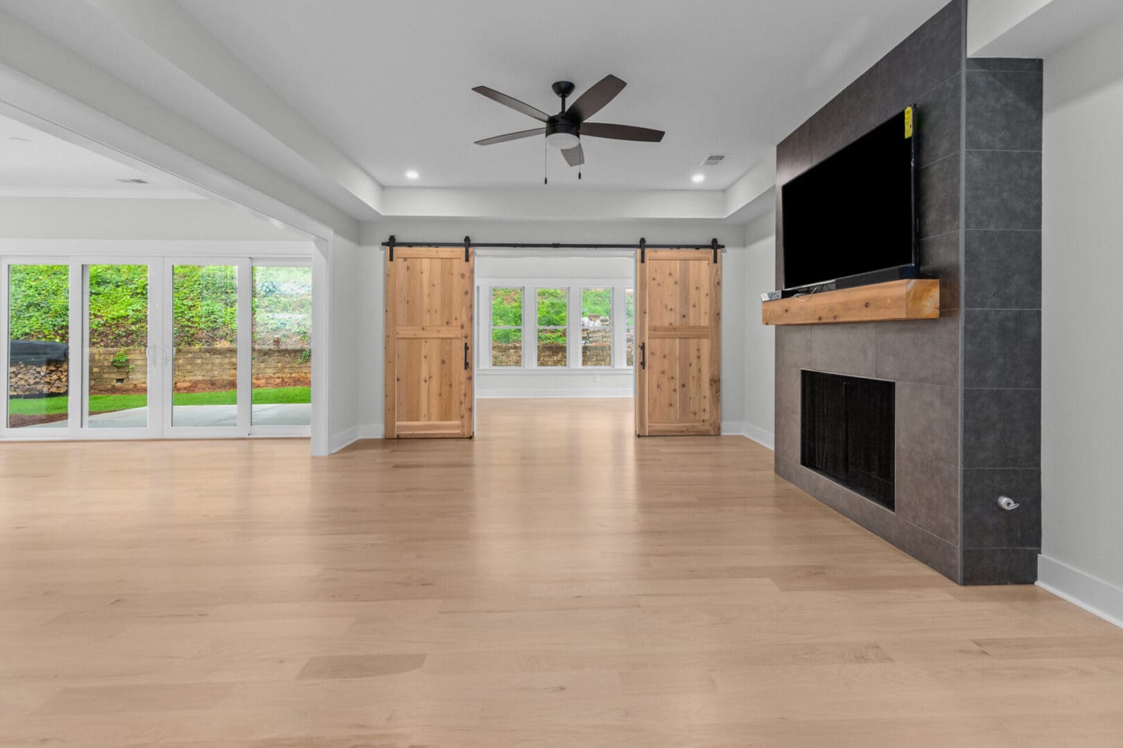 Living room with fireplace and sliding doors.